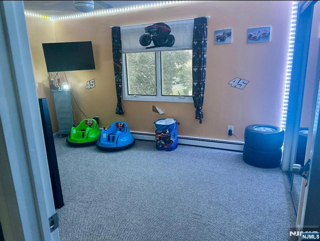 62 Frederick Street, Unit 1 Hackensack, NJ 07601 - Photo 15 of 18 a living room with furniture and a window