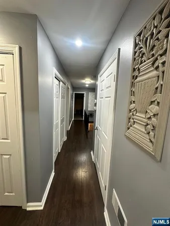 a view of gallery with wooden floor