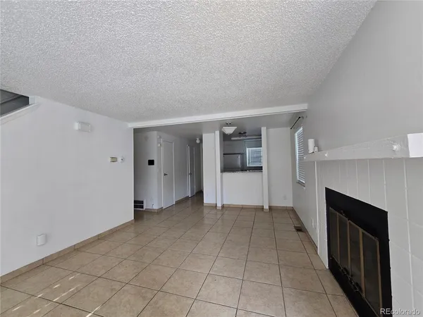 an empty room with fireplace