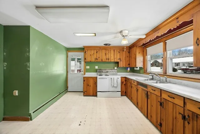 a large kitchen with a large window