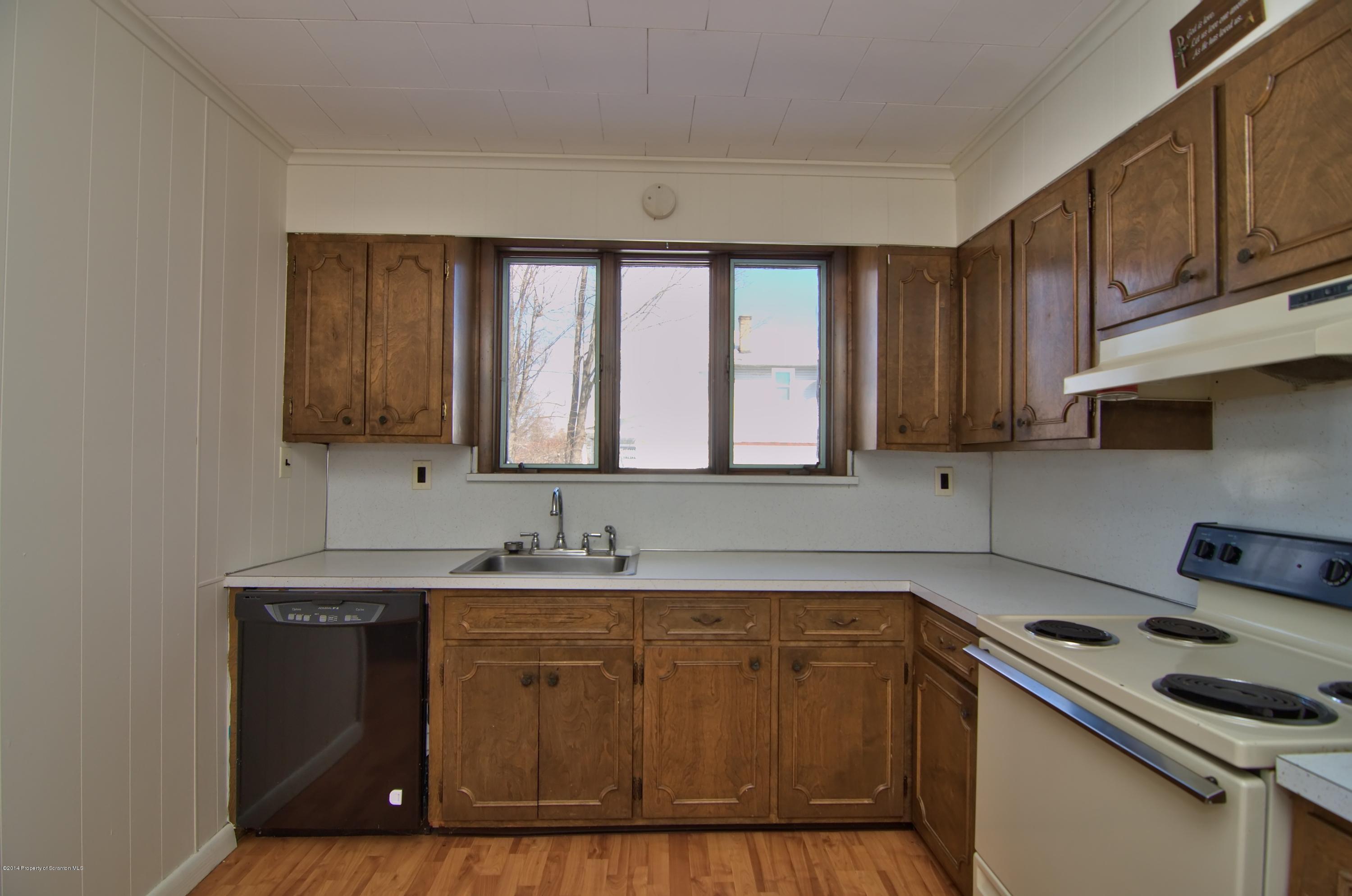 2001 Green Ridge Street Dunmore, PA 18512 - Photo 18 of 40 a kitchen with a sink stove and cabinets