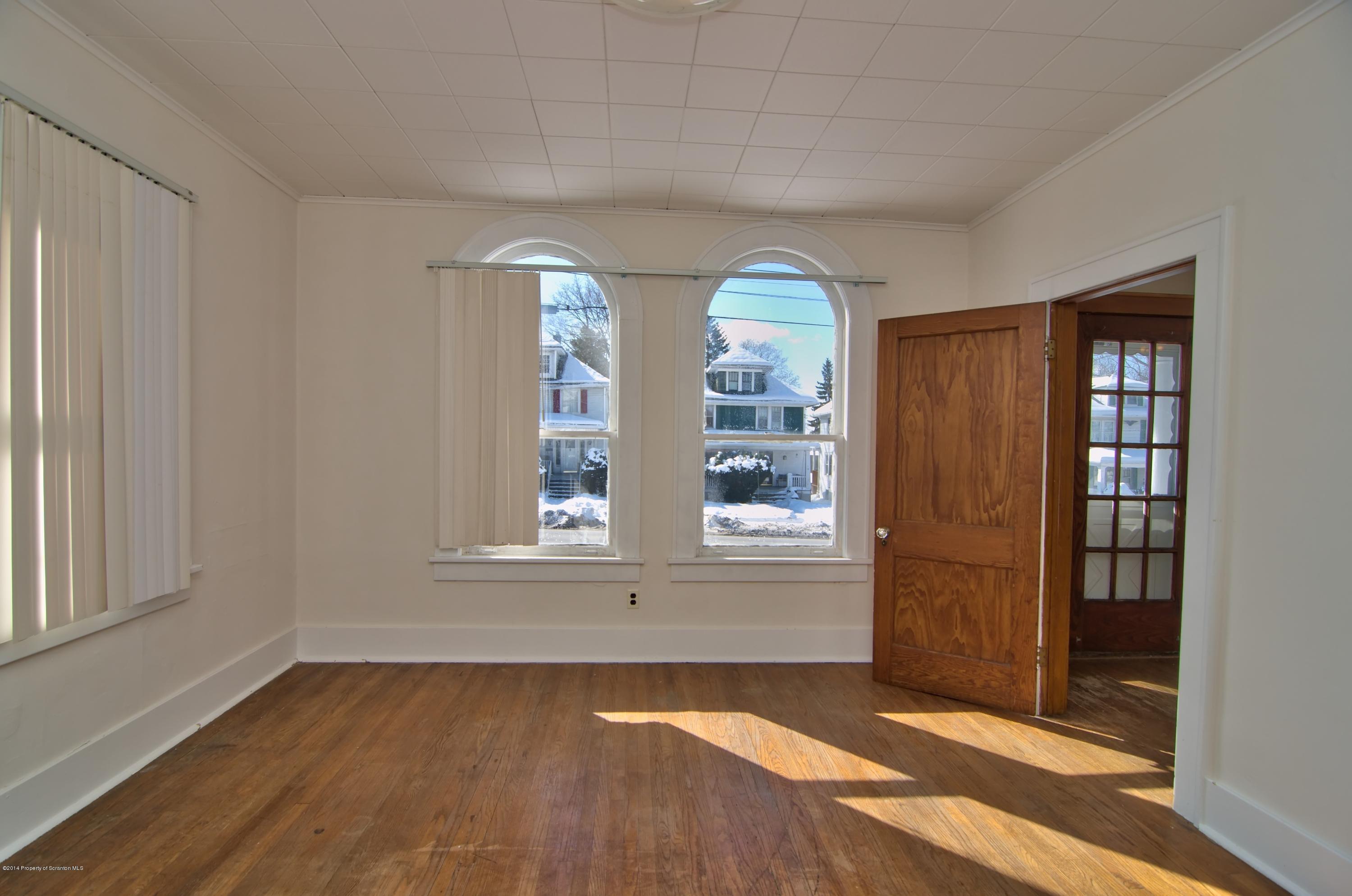 2001 Green Ridge Street Dunmore, PA 18512 - Photo 21 of 40 an empty room with wooden floor and windows
