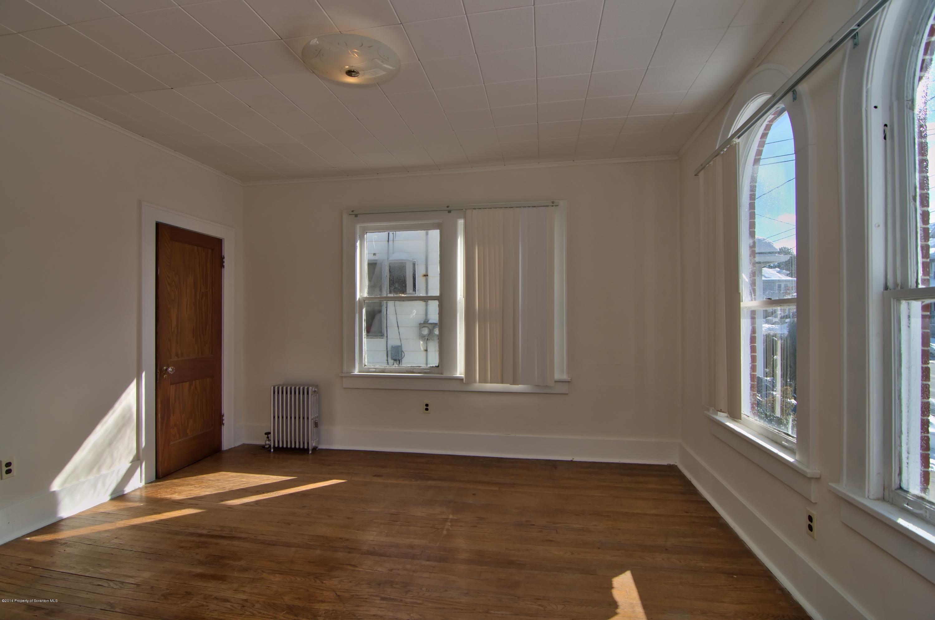 2001 Green Ridge Street Dunmore, PA 18512 - Photo 23 of 40 a view of an empty room with wooden floor and a window