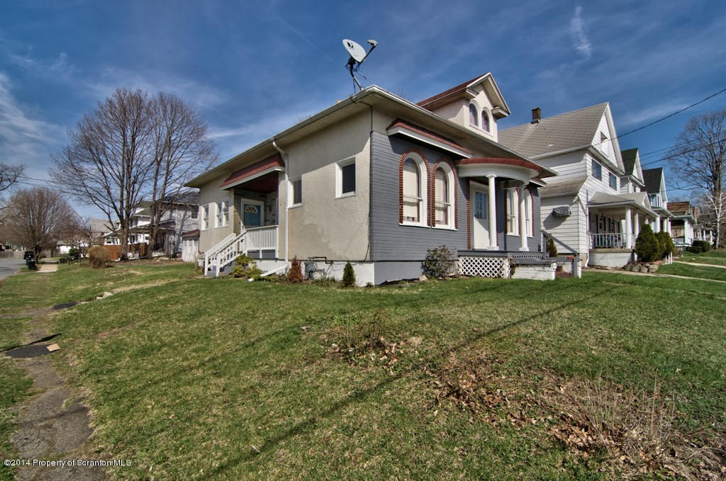 2001 Green Ridge Street Dunmore, PA 18512 - Photo 35 of 40 a front view of a house with a garden