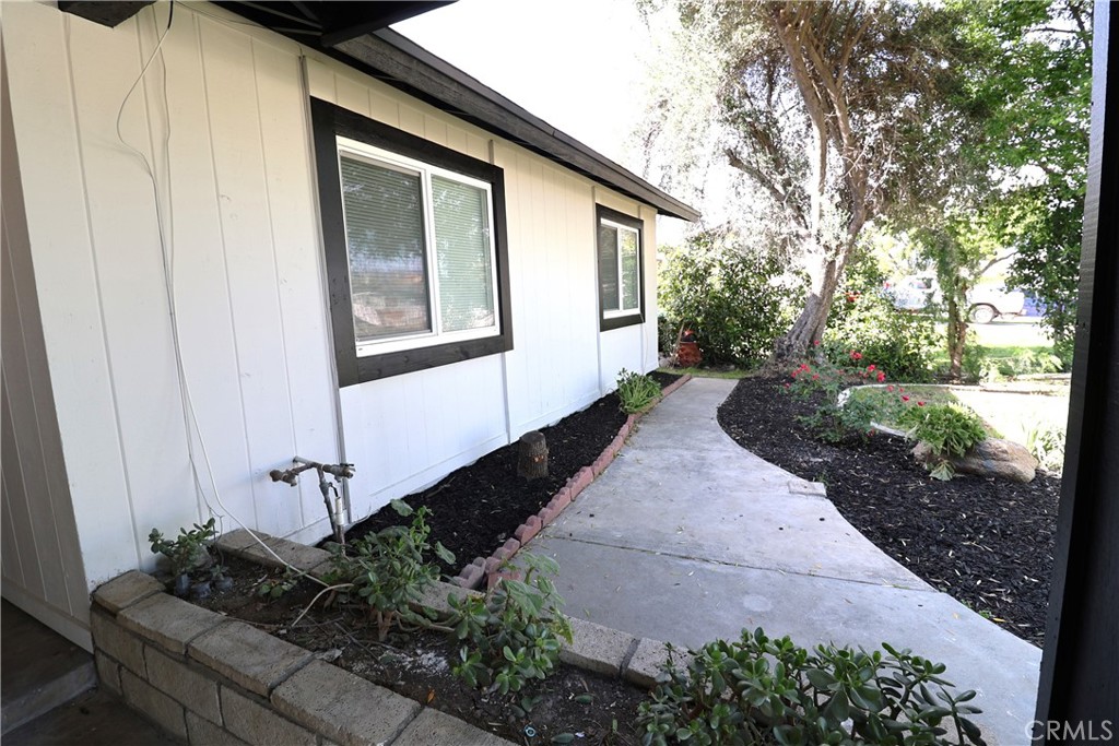 1161 Blue Ridge Lane Colton, CA 92324 - Photo 23 of 36 a front view of a house with garden