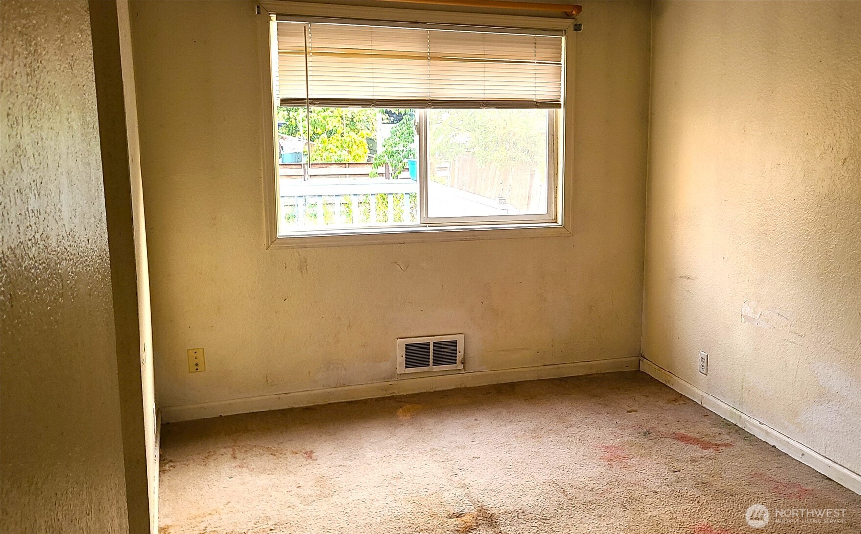529 North 103rd Street Seattle, WA 98133 - Photo 17 of 22 a view of an empty room with a window