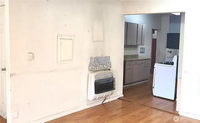 a view of a kitchen with refrigerator and microwave