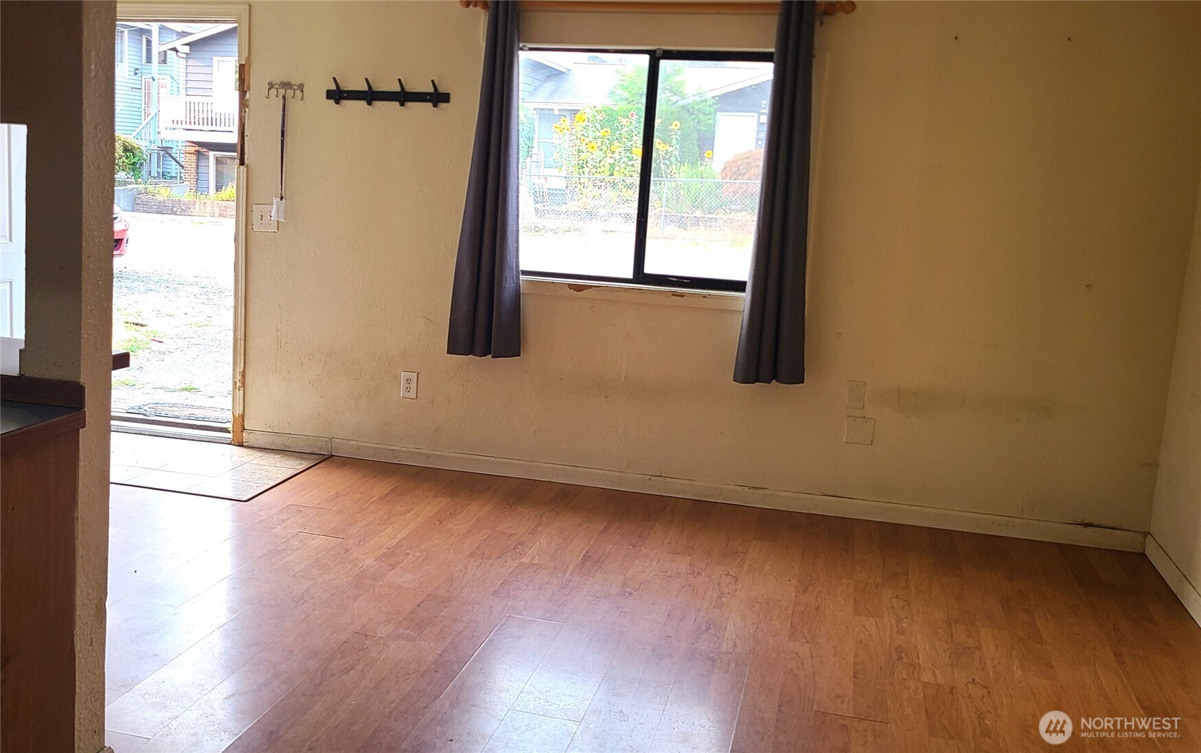 529 North 103rd Street Seattle, WA 98133 - Photo 5 of 22 an empty room with wooden floor and windows