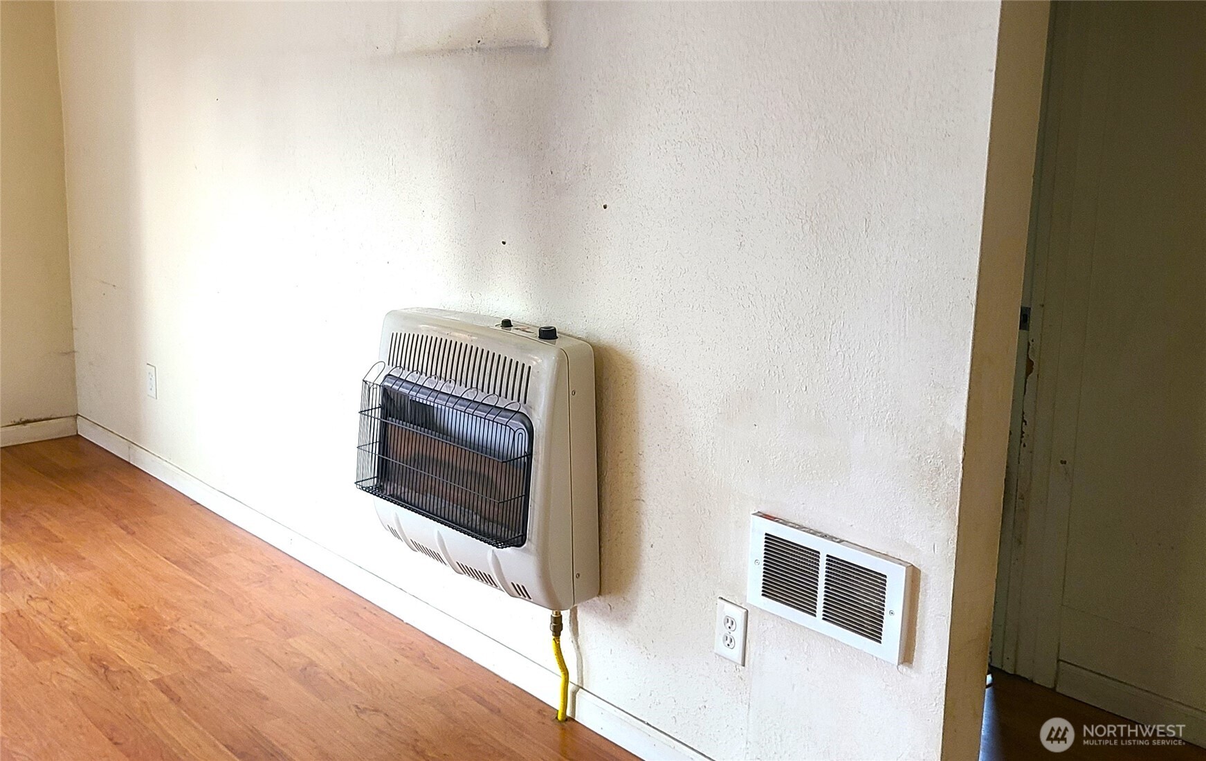529 North 103rd Street Seattle, WA 98133 - Photo 7 of 22 a living room with a fireplace furniture and a wooden floor