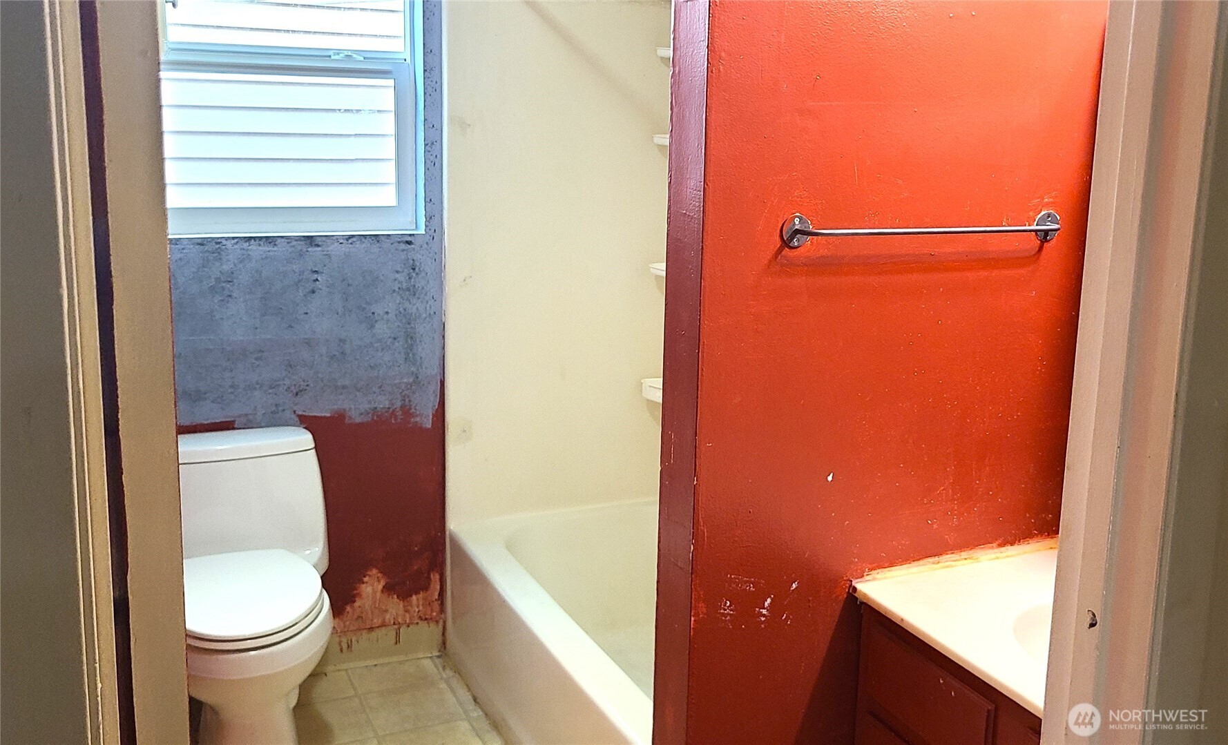 529 North 103rd Street Seattle, WA 98133 - Photo 8 of 22 a bathroom with a toilet and a shower curtain