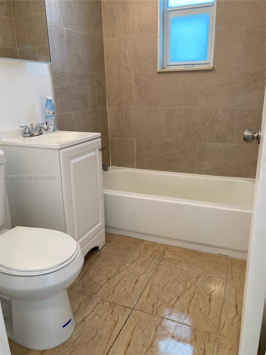 1815 Northwest 1st Court, Unit 2 Miami, FL 33136 - Photo 5 of 12 a bathroom with a toilet and a sink