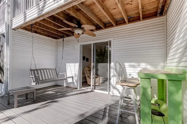 a living room with furniture chandelier and a large mirror
