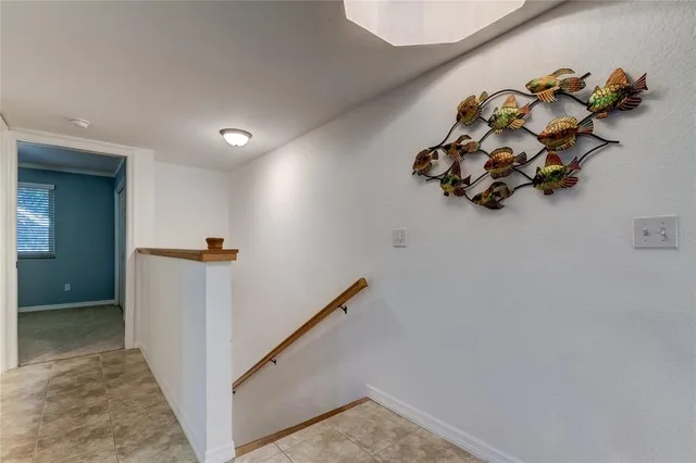 a dining room with furniture a chandelier and wooden floor