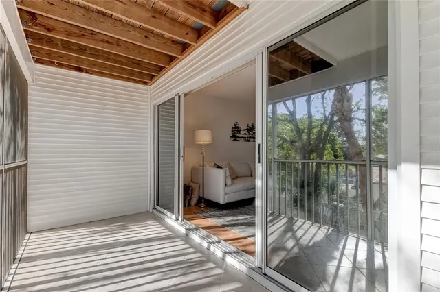 a view of a room with stairs and a window