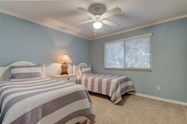 a view of a balcony with wooden floor and fence