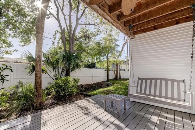 a view of a dining room with furniture wooden floor and chandelier