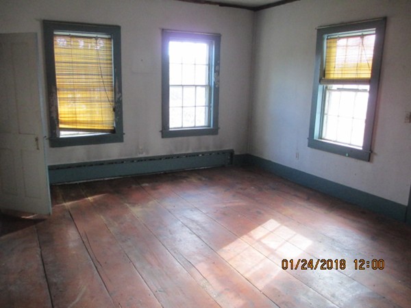 200 Greenwich Road Ware, MA 01082 - Photo 6 of 14 an empty room with wooden floor and windows