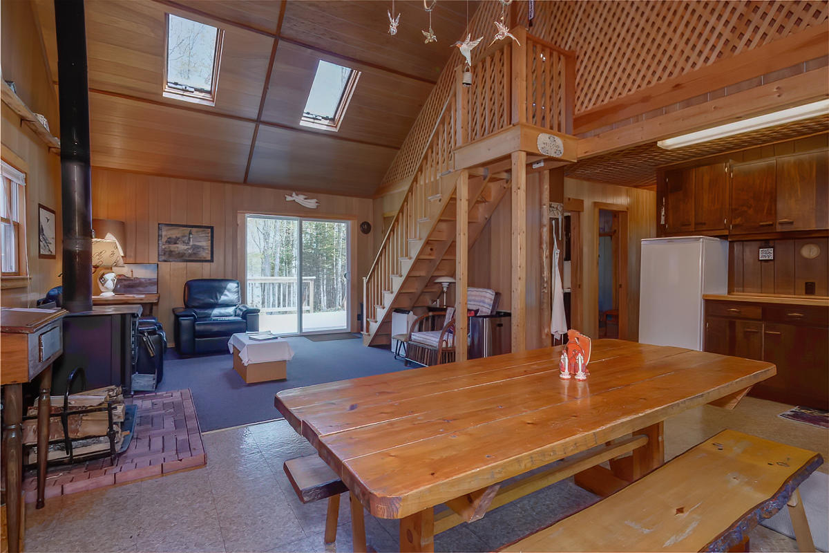 429 West Bay Road Gouldsboro, ME 04607 - Photo 8 of 55 Vaulted Living Room with Wood Stove