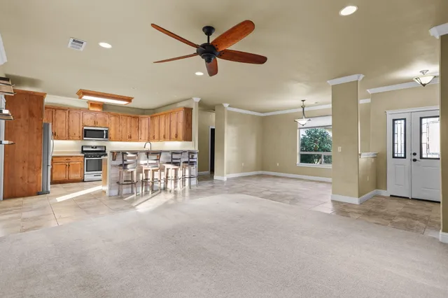 a view of a livingroom with furniture and a chandelier