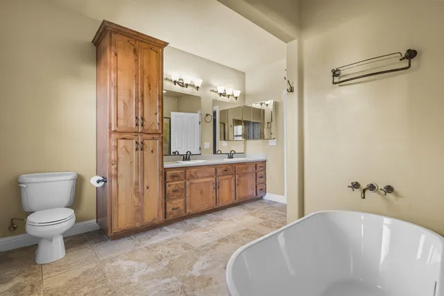 a view of a livingroom with furniture and a window
