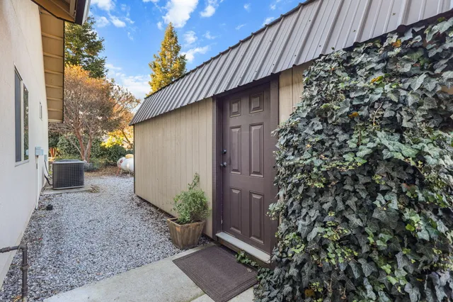 a wooden door in front of a house