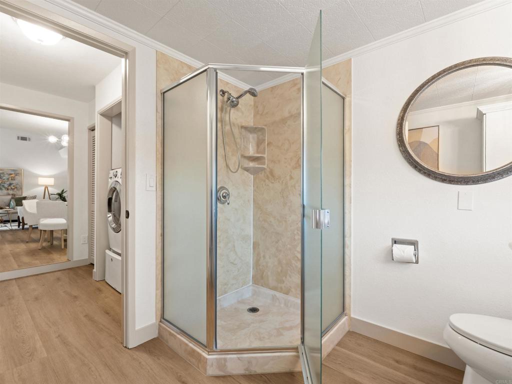 13737 Temple Street Poway, CA 92064 - Photo 29 of 38 a bathroom with a glass shower door and a mirror