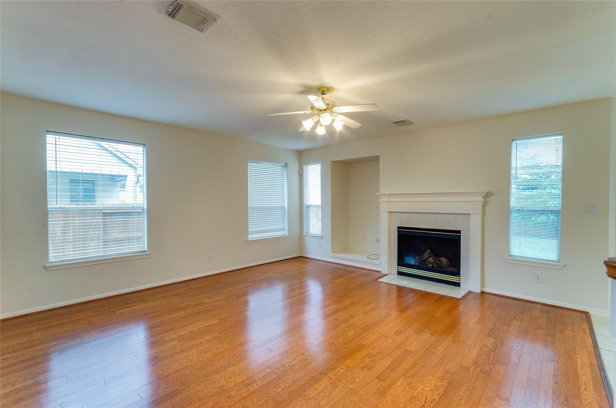 4019 Angel Spring Drive Sugar Land, TX 77479 - Photo 10 of 50 an empty room with windows fireplace and a sink