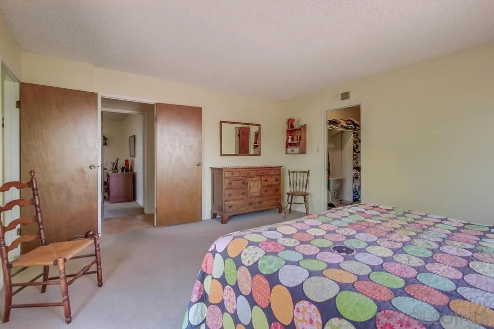 940 Mountain View Road El Cajon, CA 92021 - Photo 30 of 65 a bedroom with a bed and a dresser
