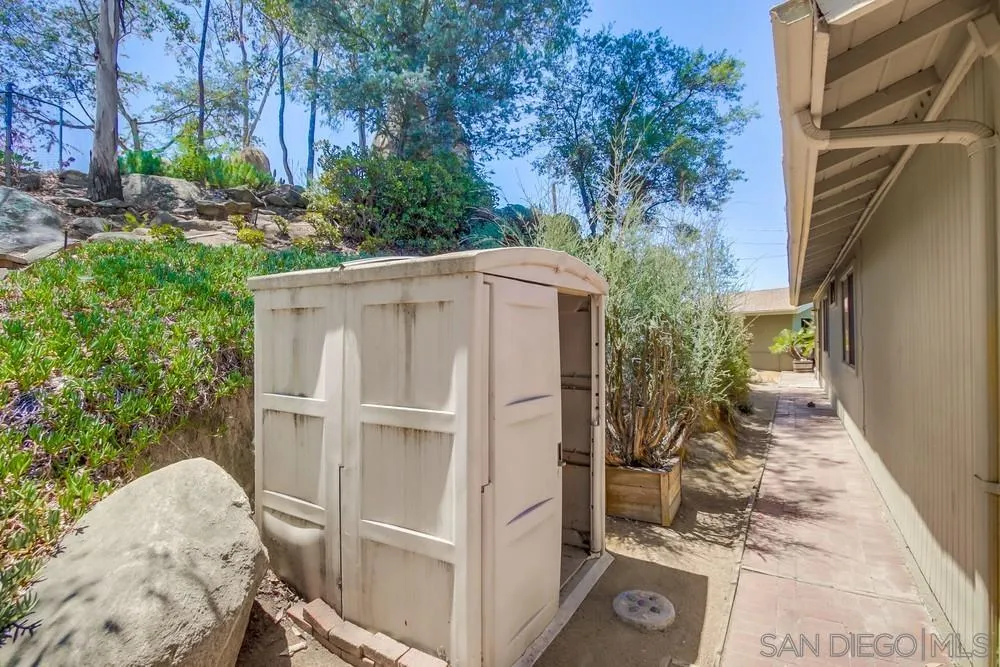 940 Mountain View Road El Cajon, CA 92021 - Photo 49 of 65 a backyard of a house with plants and outdoor seating