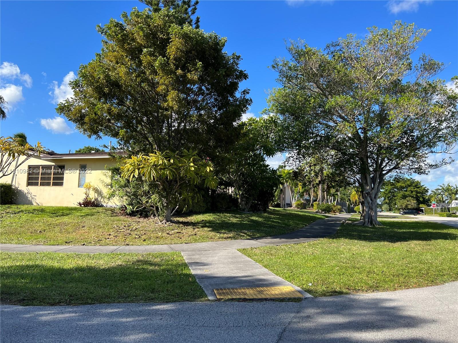 16030 Southwest 99th Avenue Miami, FL 33157 - Photo 3 of 13 a view of a yard with plants and trees