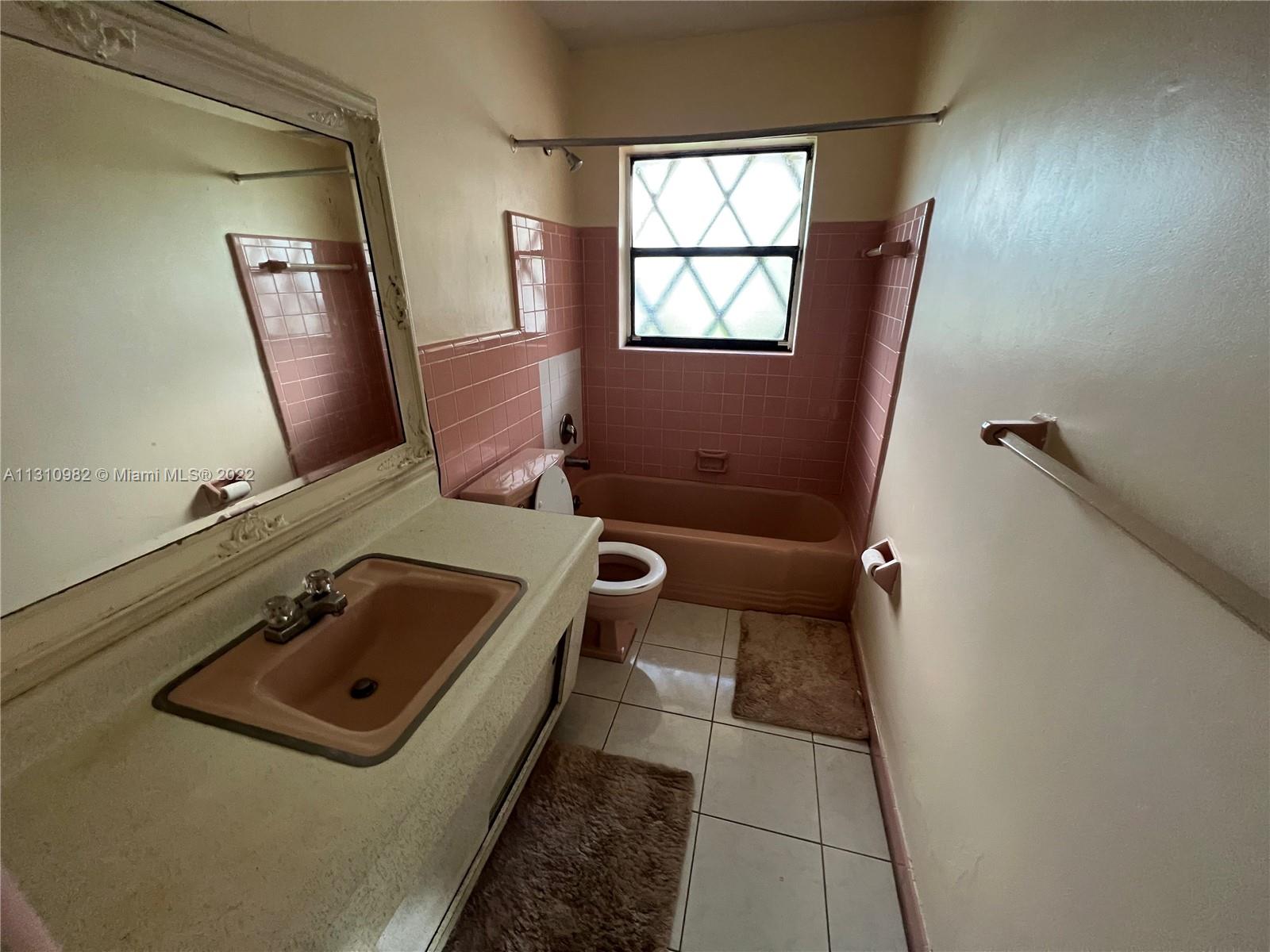 16030 Southwest 99th Avenue Miami, FL 33157 - Photo 7 of 13 a bathroom with a sink toilet and mirror