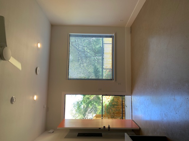 2800 Pearl Street Austin, TX 78705 - Photo 2 of 8 an empty room with wooden floor and windows