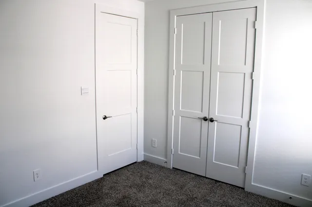 a bathroom with a sink vanity and toilet