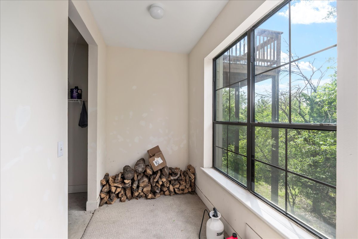 7701 Rialto Boulevard, Unit 91 Austin, TX 78735 - Photo 27 of 39 a view of a room with wooden floor and windows