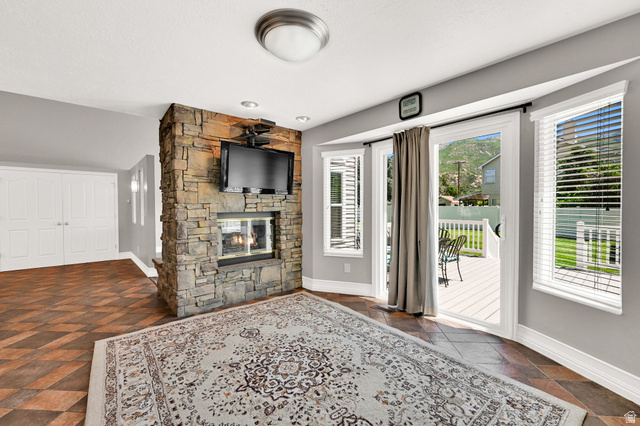 4792 Glasmann Way South Ogden, UT 84403 - Photo 42 of 70 Stone-clad fireplace with a built-in media niche including TV