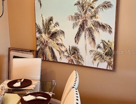 9320 Clubside Circle, Unit 2308 Sarasota, FL 34238 - Photo 14 of 51 a close view of a sink a mirror and a potted plant