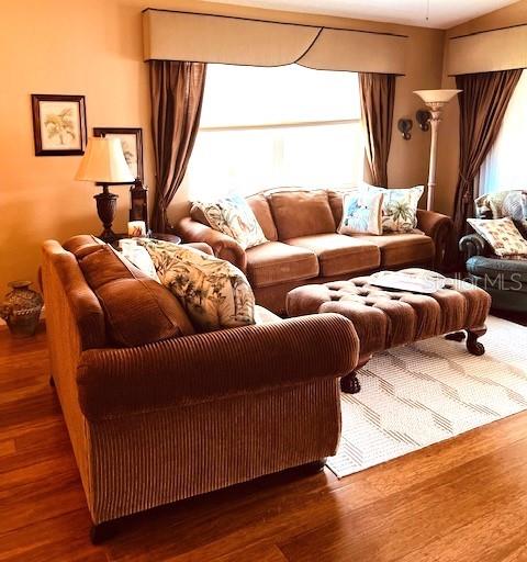 9320 Clubside Circle, Unit 2308 Sarasota, FL 34238 - Photo 16 of 51 a living room with furniture and a window