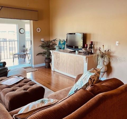 9320 Clubside Circle, Unit 2308 Sarasota, FL 34238 - Photo 17 of 51 a living room with furniture and a flat screen tv