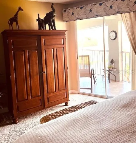 a view of a room with wooden floor and windows