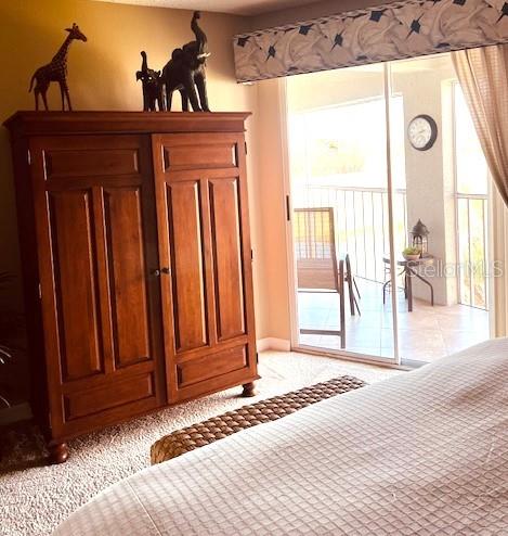 9320 Clubside Circle, Unit 2308 Sarasota, FL 34238 - Photo 22 of 51 a view of a room with wooden floor and windows