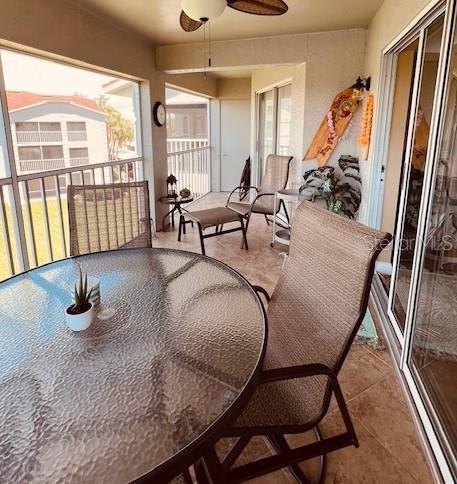 9320 Clubside Circle, Unit 2308 Sarasota, FL 34238 - Photo 29 of 51 a dining room with furniture and wooden floor