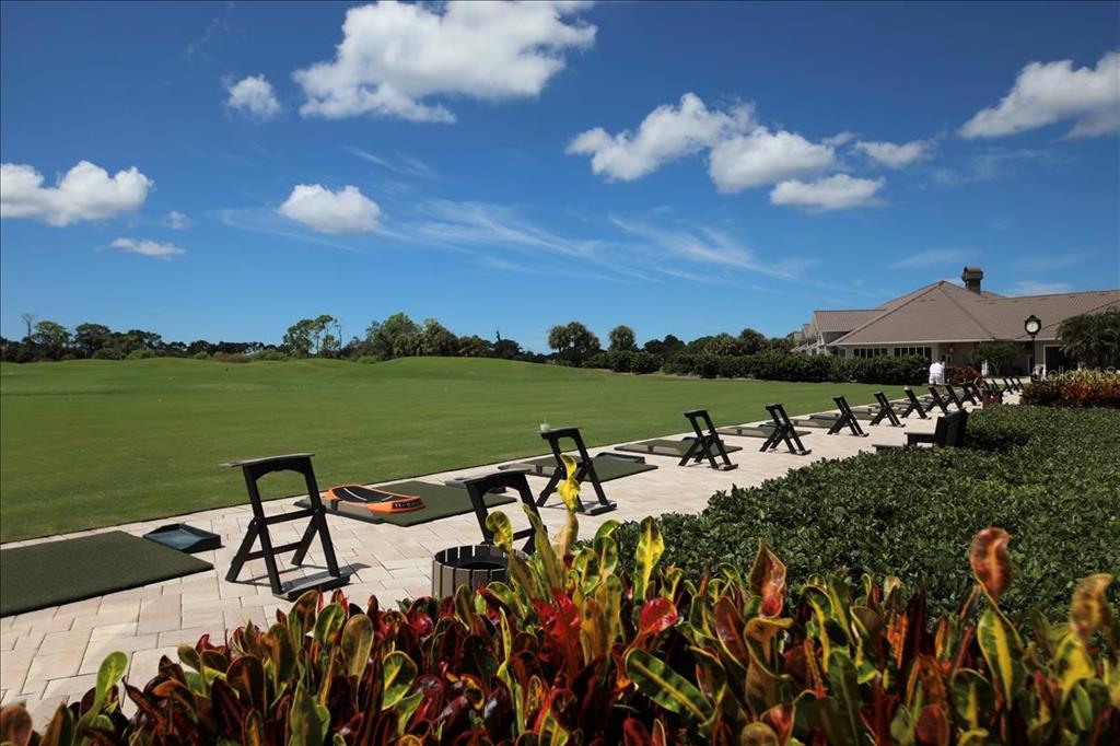 9320 Clubside Circle, Unit 2308 Sarasota, FL 34238 - Photo 37 of 51 a view of a lake with houses in the back
