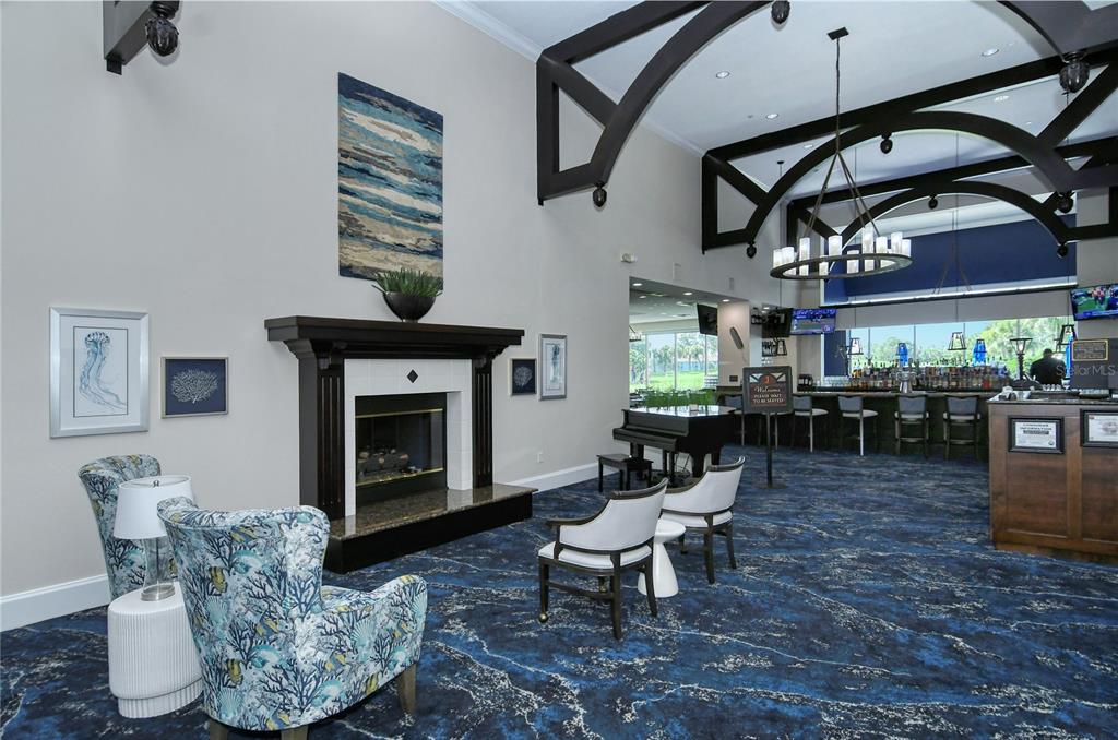 9320 Clubside Circle, Unit 2308 Sarasota, FL 34238 - Photo 42 of 51 a living room with furniture and a fireplace