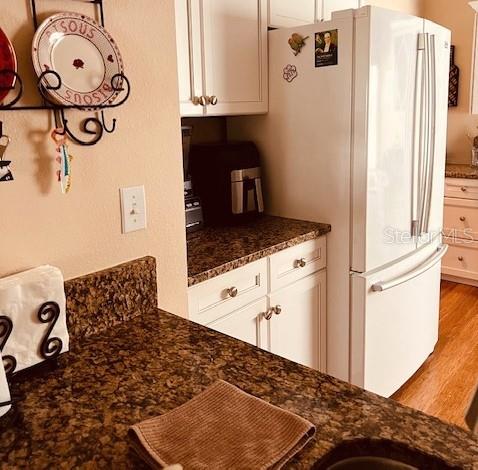 9320 Clubside Circle, Unit 2308 Sarasota, FL 34238 - Photo 6 of 51 a kitchen with a refrigerator and a stove