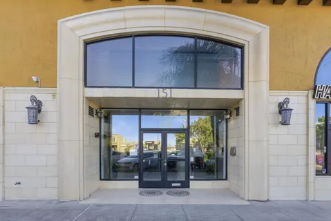 a front view of a house with glass windows
