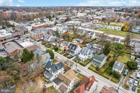 an aerial view of residential houses with outdoor space