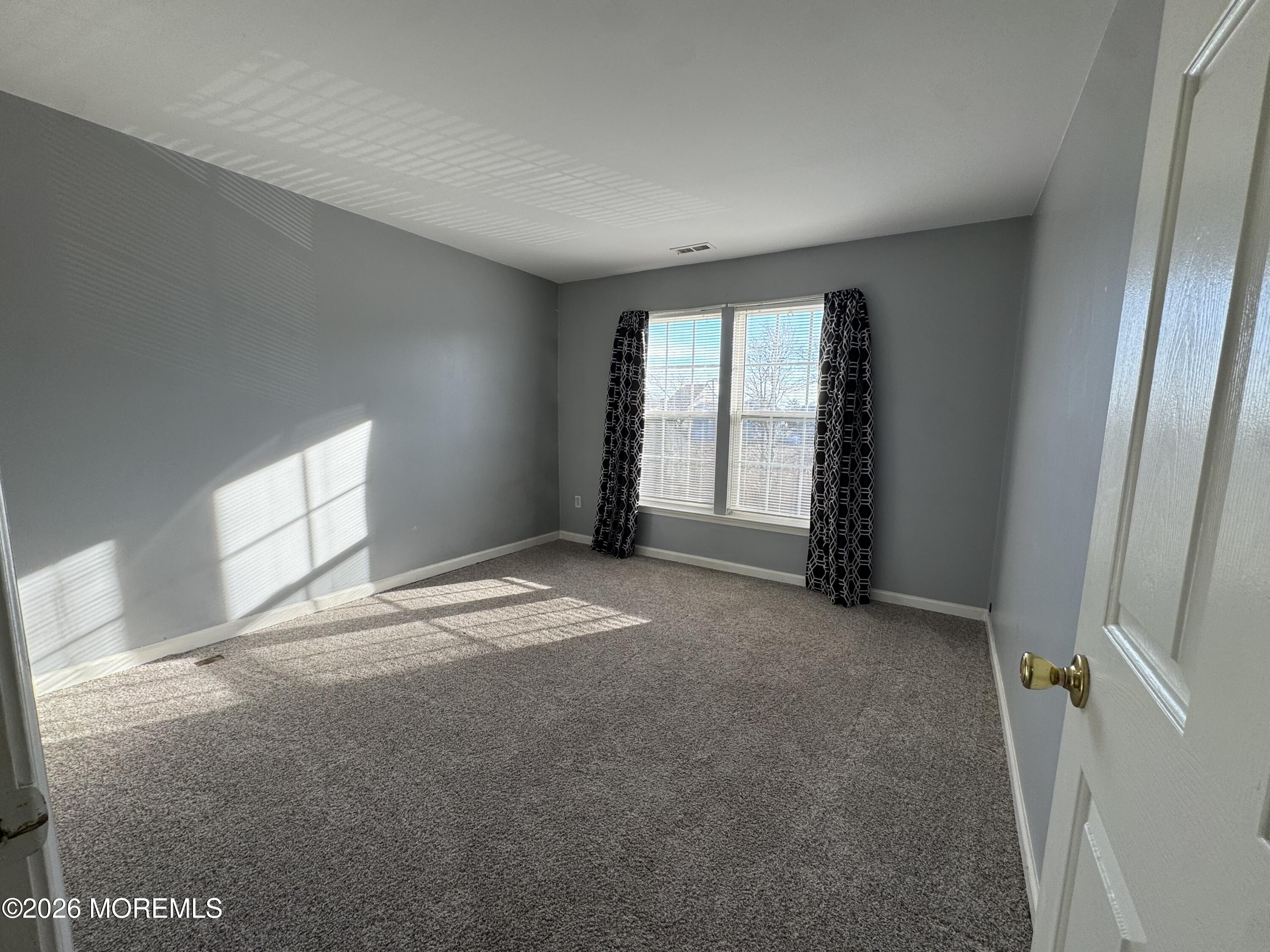 3 Skimmer Lane, Unit 38 Bayville, NJ 08721 - Photo 12 of 14 an empty room with windows