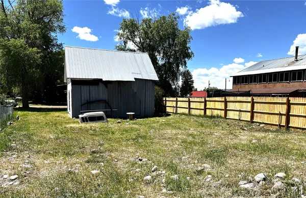 a view of backyard with green space