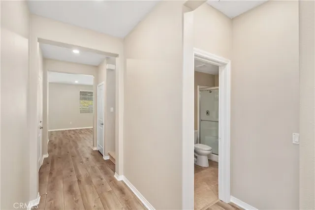 a view of a bathroom from a hallway