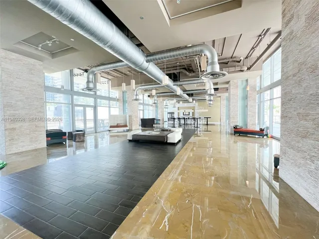 a view of a living room and kitchen floor